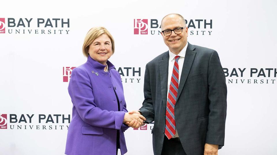 President Doran and President Healey shake hands