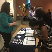 students looking at pamphlets